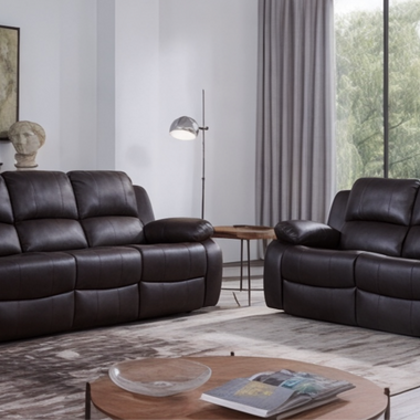 A black leather recliner sofa and a 3-seater sofa arranged in a living room setting with a modern design.
